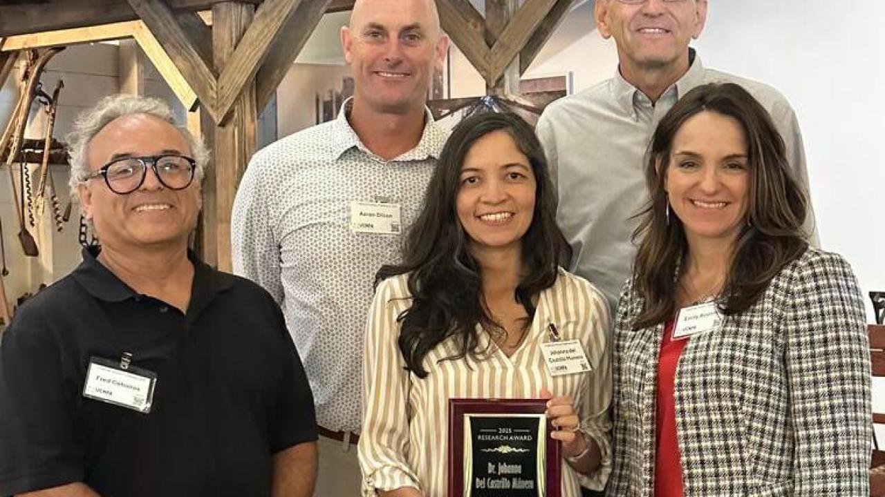A group photo shows Dr. Johanna Del Castillo Múnera holding a plaque for the 2025 Plant California Alliance Research Award, standing with four colleagues who are smiling and celebrating the recognition.