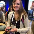 Abigail Stack Holding an Excellence in Industry Award